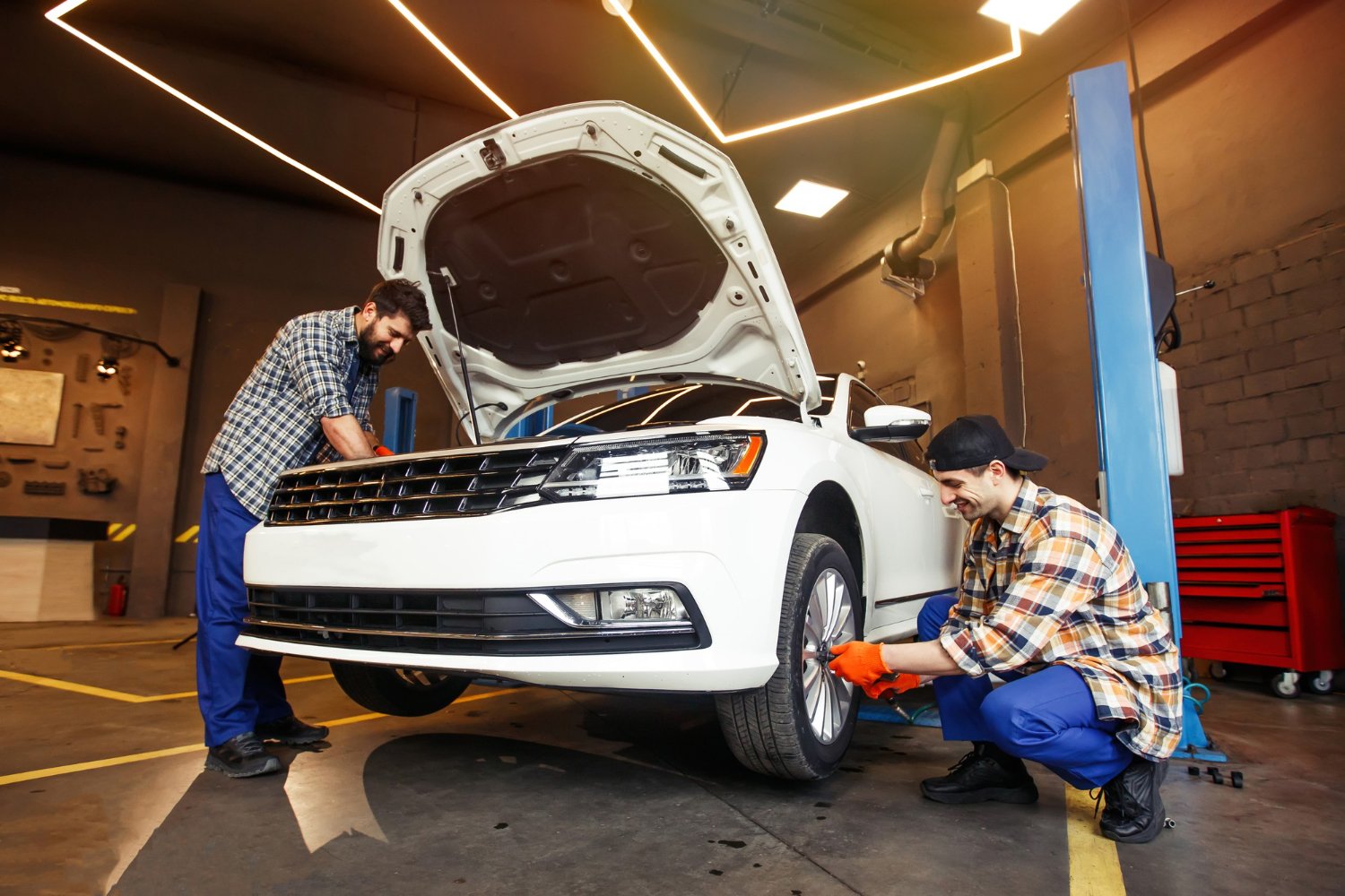 ROAM technicians servicing a car on-site