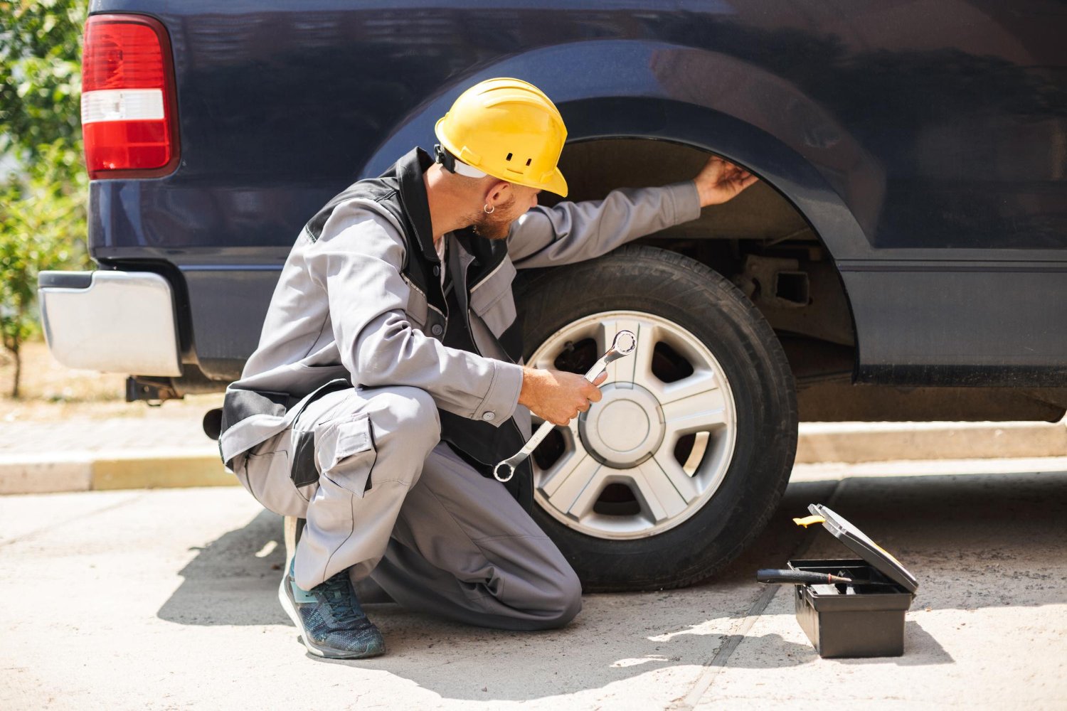 ROAM technician fixing a wheel roadside