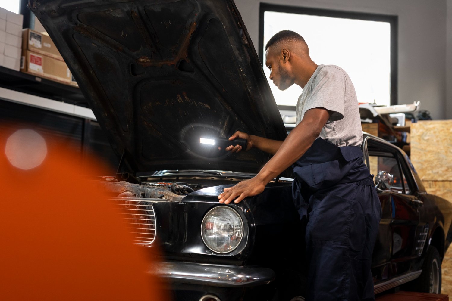 ROAM technician restoring a classic car